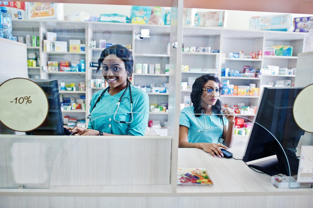 Two african american pharmacist working in drugstore at hospital pharmacy African healthcare