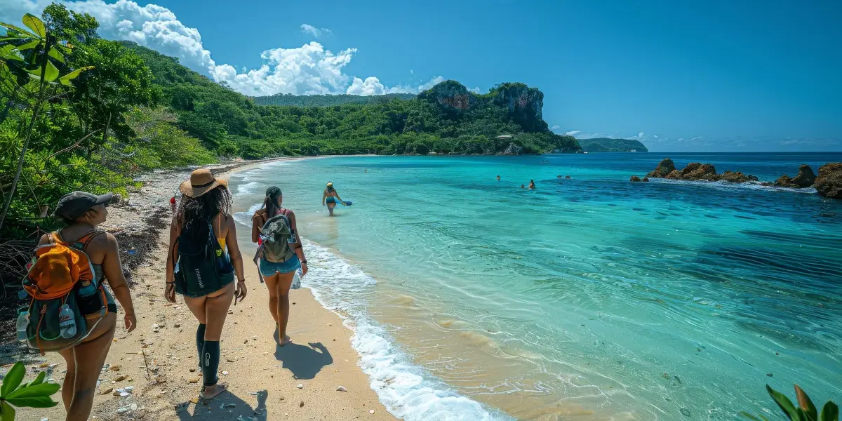 A group strolling on beach enjoying landscape and coastal views